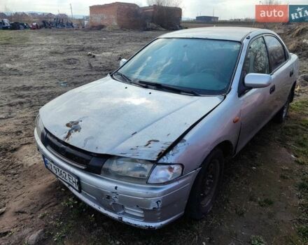 Серый Мазда 323, объемом двигателя 1.5 л и пробегом 250 тыс. км за 1000 $, фото 1 на Automoto.ua