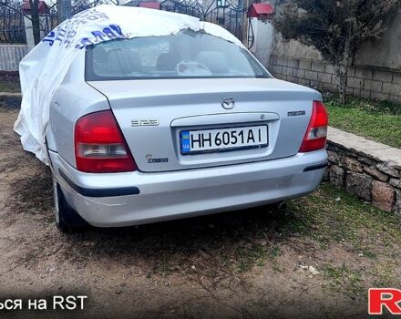 Серый Мазда 323, объемом двигателя 1.8 л и пробегом 217 тыс. км за 900 $, фото 1 на Automoto.ua