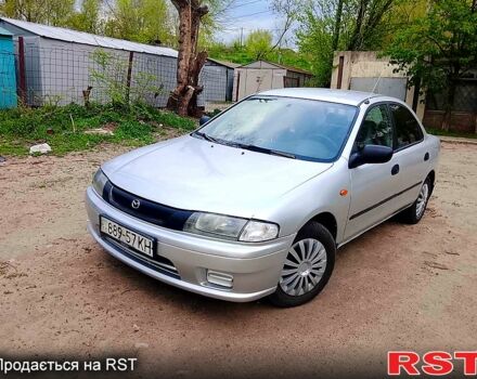 Серый Мазда 323, объемом двигателя 1.5 л и пробегом 245 тыс. км за 1500 $, фото 1 на Automoto.ua