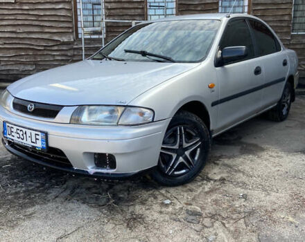 Серый Мазда 323, объемом двигателя 2 л и пробегом 265 тыс. км за 1200 $, фото 1 на Automoto.ua
