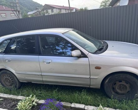 Серый Мазда 323, объемом двигателя 2 л и пробегом 250 тыс. км за 750 $, фото 1 на Automoto.ua