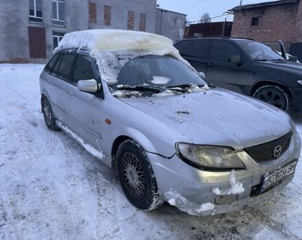 Серый Мазда 323, объемом двигателя 2 л и пробегом 250 тыс. км за 1750 $, фото 1 на Automoto.ua