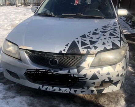 Серый Мазда 323, объемом двигателя 2 л и пробегом 250 тыс. км за 1000 $, фото 1 на Automoto.ua