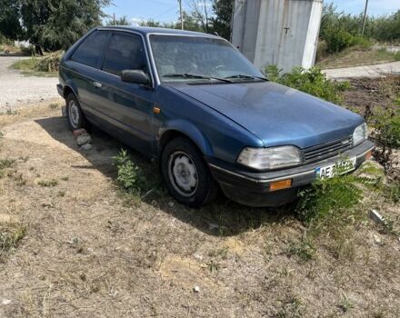 Синій Мазда 323, об'ємом двигуна 1.5 л та пробігом 300 тис. км за 1100 $, фото 1 на Automoto.ua