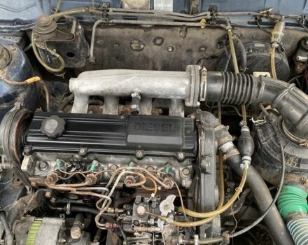 Синий Мазда 323, объемом двигателя 2 л и пробегом 465 тыс. км за 1000 $, фото 7 на Automoto.ua