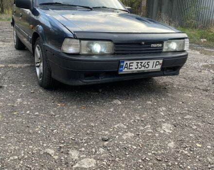 Синий Мазда 323, объемом двигателя 2 л и пробегом 465 тыс. км за 1000 $, фото 2 на Automoto.ua
