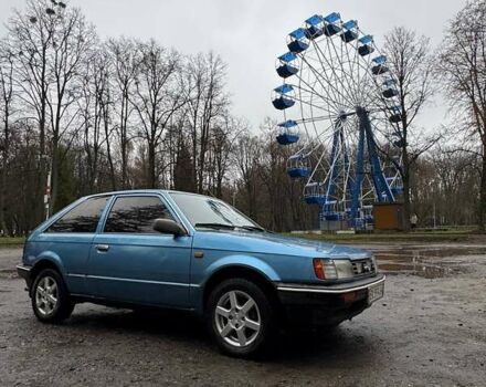 Синий Мазда 323, объемом двигателя 1.32 л и пробегом 220 тыс. км за 950 $, фото 1 на Automoto.ua