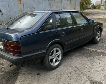 Синий Мазда 323, объемом двигателя 2 л и пробегом 465 тыс. км за 1000 $, фото 1 на Automoto.ua