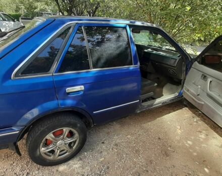 Синий Мазда 323, объемом двигателя 1.3 л и пробегом 378 тыс. км за 950 $, фото 5 на Automoto.ua