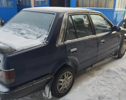 Синий Мазда 323, объемом двигателя 1.5 л и пробегом 300 тыс. км за 900 $, фото 2 на Automoto.ua