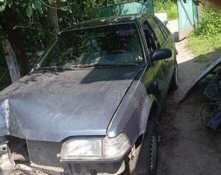 Синий Мазда 323, объемом двигателя 6 л и пробегом 330 тыс. км за 384 $, фото 1 на Automoto.ua