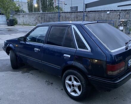 Синий Мазда 323, объемом двигателя 1.5 л и пробегом 505 тыс. км за 1000 $, фото 3 на Automoto.ua