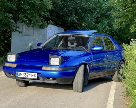 Синій Мазда 323, об'ємом двигуна 1.8 л та пробігом 435 тис. км за 3400 $, фото 4 на Automoto.ua