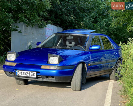 Синій Мазда 323, об'ємом двигуна 1.8 л та пробігом 435 тис. км за 3400 $, фото 4 на Automoto.ua