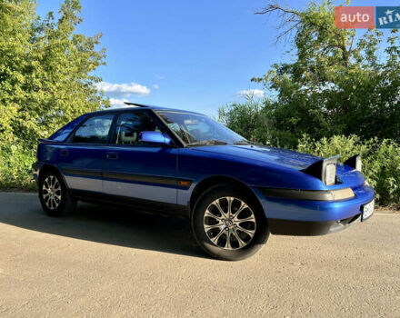 Синій Мазда 323, об'ємом двигуна 1.8 л та пробігом 435 тис. км за 3400 $, фото 1 на Automoto.ua