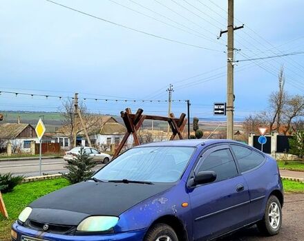 Синій Мазда 323, об'ємом двигуна 1.3 л та пробігом 200 тис. км за 1150 $, фото 4 на Automoto.ua