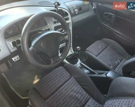 Синий Мазда 323, объемом двигателя 1.5 л и пробегом 350 тыс. км за 1499 $, фото 2 на Automoto.ua