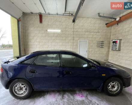 Синий Мазда 323, объемом двигателя 1.49 л и пробегом 329 тыс. км за 1500 $, фото 4 на Automoto.ua
