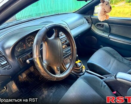 Синій Мазда 323, об'ємом двигуна 1.5 л та пробігом 348 тис. км за 2000 $, фото 4 на Automoto.ua
