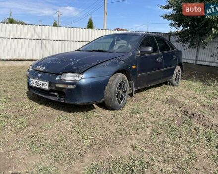 Синий Мазда 323, объемом двигателя 1.5 л и пробегом 250 тыс. км за 1900 $, фото 2 на Automoto.ua