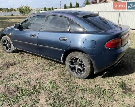 Синий Мазда 323, объемом двигателя 1.5 л и пробегом 250 тыс. км за 1900 $, фото 1 на Automoto.ua