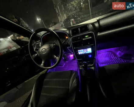 Синій Мазда 323, об'ємом двигуна 1.49 л та пробігом 343 тис. км за 2100 $, фото 9 на Automoto.ua