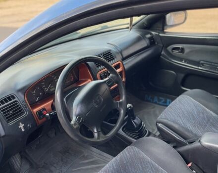 Синий Мазда 323, объемом двигателя 1.5 л и пробегом 100 тыс. км за 1500 $, фото 4 на Automoto.ua