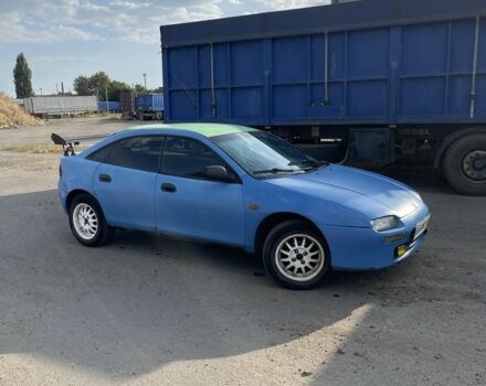 Синий Мазда 323, объемом двигателя 1.5 л и пробегом 100 тыс. км за 1500 $, фото 1 на Automoto.ua