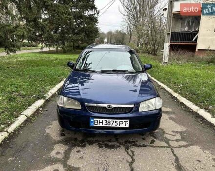 Синий Мазда 323, объемом двигателя 1.5 л и пробегом 315 тыс. км за 2400 $, фото 1 на Automoto.ua