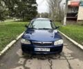 Синий Мазда 323, объемом двигателя 1.5 л и пробегом 315 тыс. км за 2400 $, фото 1 на Automoto.ua