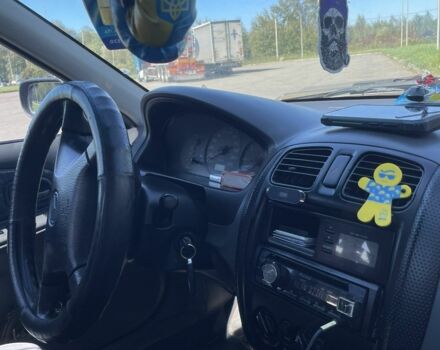 Синий Мазда 323, объемом двигателя 2 л и пробегом 240 тыс. км за 2500 $, фото 4 на Automoto.ua