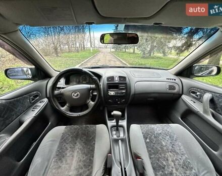 Синий Мазда 323, объемом двигателя 1.5 л и пробегом 315 тыс. км за 2400 $, фото 7 на Automoto.ua