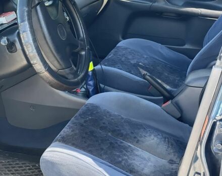 Синий Мазда 323, объемом двигателя 2 л и пробегом 240 тыс. км за 2500 $, фото 3 на Automoto.ua