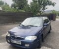 Синий Мазда 323, объемом двигателя 2 л и пробегом 295 тыс. км за 1250 $, фото 1 на Automoto.ua