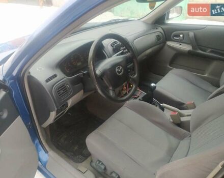 Синий Мазда 323, объемом двигателя 1.6 л и пробегом 170 тыс. км за 3950 $, фото 2 на Automoto.ua