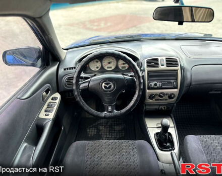 Синій Мазда 323, об'ємом двигуна 2 л та пробігом 300 тис. км за 3000 $, фото 11 на Automoto.ua