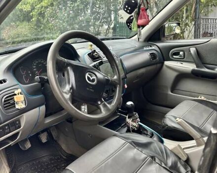 Синий Мазда 323, объемом двигателя 2 л и пробегом 353 тыс. км за 2850 $, фото 2 на Automoto.ua