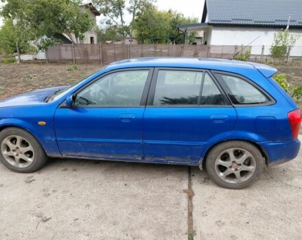 Синій Мазда 323, об'ємом двигуна 2 л та пробігом 300 тис. км за 750 $, фото 1 на Automoto.ua