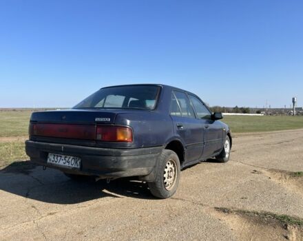 Синий Мазда 323, объемом двигателя 1.7 л и пробегом 350 тыс. км за 40000 $, фото 2 на Automoto.ua