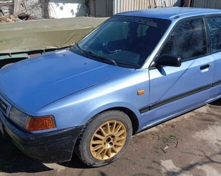 Синій Мазда 323, об'ємом двигуна 1.3 л та пробігом 322 тис. км за 1000 $, фото 2 на Automoto.ua