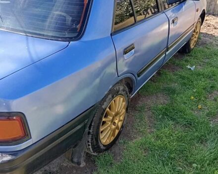 Синій Мазда 323, об'ємом двигуна 1.3 л та пробігом 322 тис. км за 1000 $, фото 4 на Automoto.ua