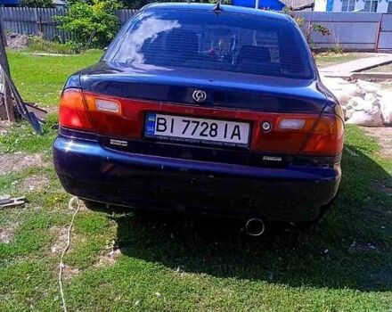 Синий Мазда 323, объемом двигателя 1.3 л и пробегом 429 тыс. км за 2100 $, фото 1 на Automoto.ua