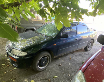Синій Мазда 323, об'ємом двигуна 1.3 л та пробігом 395 тис. км за 1750 $, фото 3 на Automoto.ua