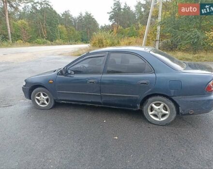 Синий Мазда 323, объемом двигателя 1.49 л и пробегом 250 тыс. км за 1450 $, фото 4 на Automoto.ua