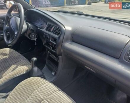 Синий Мазда 323, объемом двигателя 1.5 л и пробегом 295 тыс. км за 2300 $, фото 7 на Automoto.ua