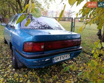 Синий Мазда 323, объемом двигателя 1.69 л и пробегом 250 тыс. км за 750 $, фото 5 на Automoto.ua