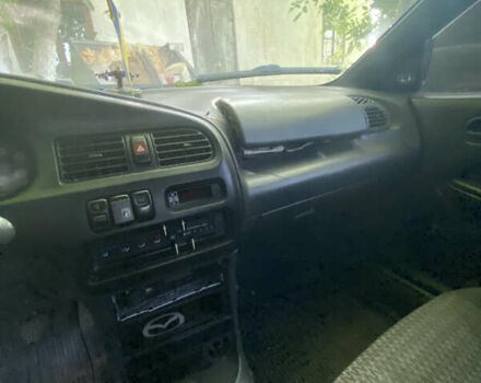 Синій Мазда 323, об'ємом двигуна 1.3 л та пробігом 395 тис. км за 1750 $, фото 7 на Automoto.ua