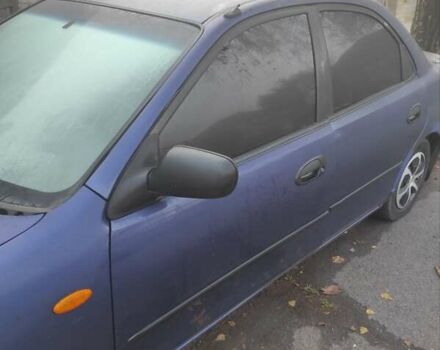 Синий Мазда 323, объемом двигателя 1.5 л и пробегом 295 тыс. км за 2300 $, фото 2 на Automoto.ua