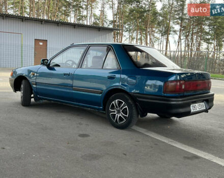 Синий Мазда 323, объемом двигателя 1.6 л и пробегом 250 тыс. км за 1900 $, фото 2 на Automoto.ua