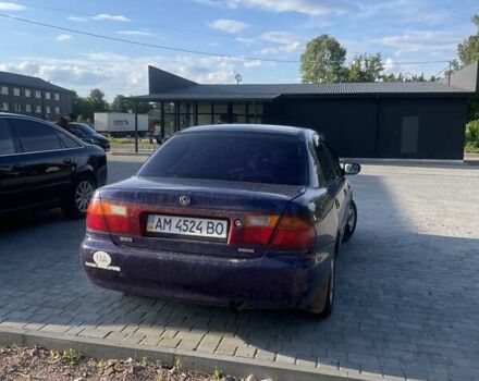 Синий Мазда 323, объемом двигателя 1.5 л и пробегом 380 тыс. км за 1400 $, фото 3 на Automoto.ua
